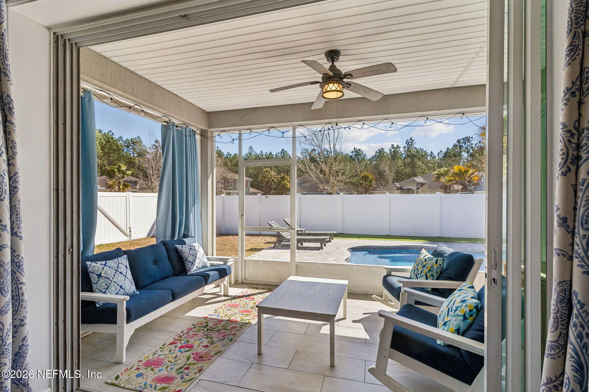 96048 Breezeway Court Yulee, FL 32097 - Photo 6 of 26 a living room with furniture and a large window