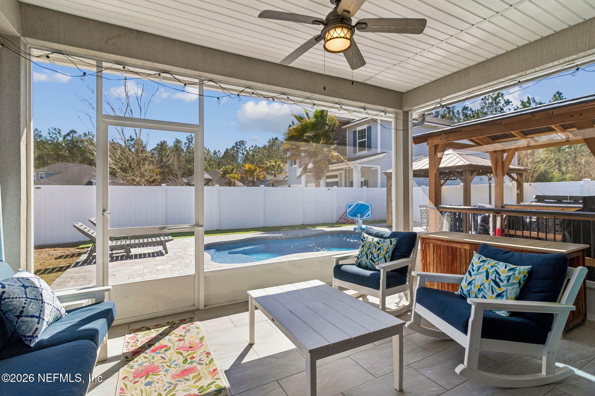 96048 Breezeway Court Yulee, FL 32097 - Photo 7 of 26 a living room with a couch and a table