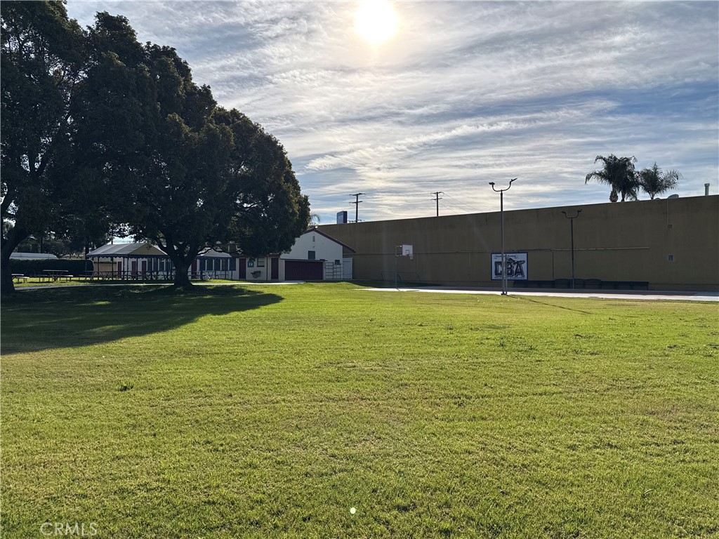 405 South Azusa Avenue Azusa, CA 91702 - Photo 13 of 70 a view of a swimming pool with an outdoor seating and a lots of trees