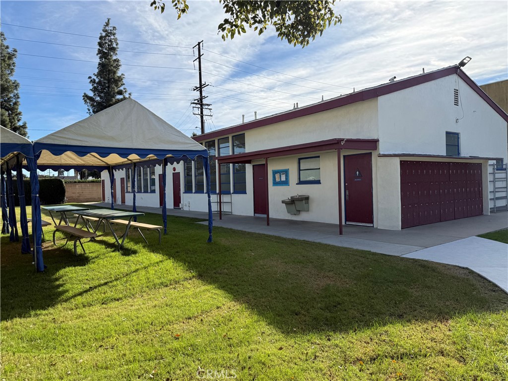 405 South Azusa Avenue Azusa, CA 91702 - Photo 38 of 70 a view of a house with a backyard and a patio