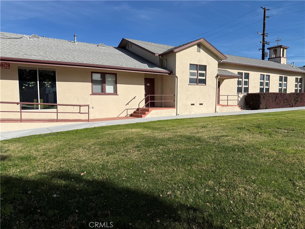 405 South Azusa Avenue Azusa, CA 91702 - Photo 51 of 70 a front view of a house with a yard