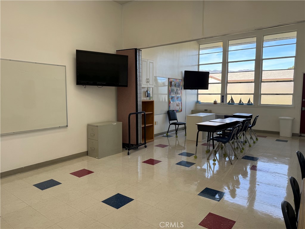 405 South Azusa Avenue Azusa, CA 91702 - Photo 54 of 70 a workspace with furniture and flat screen tv