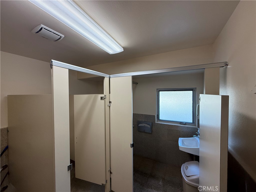 405 South Azusa Avenue Azusa, CA 91702 - Photo 57 of 70 a bathroom with a toilet and a mirror