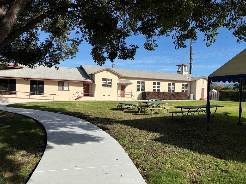 405 South Azusa Avenue Azusa, CA 91702 - Photo 62 of 70 a front view of a house with a garden