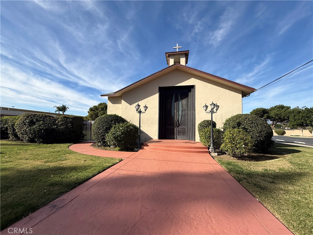 405 South Azusa Avenue Azusa, CA 91702 - Photo 7 of 70 a front view of a house with a yard