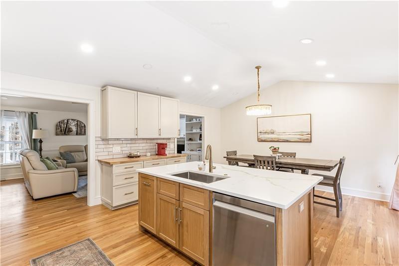 3890 Jim Owens Road Northwest Kennesaw, GA 30152 - Photo 11 of 43 a kitchen with a sink stove and cabinets