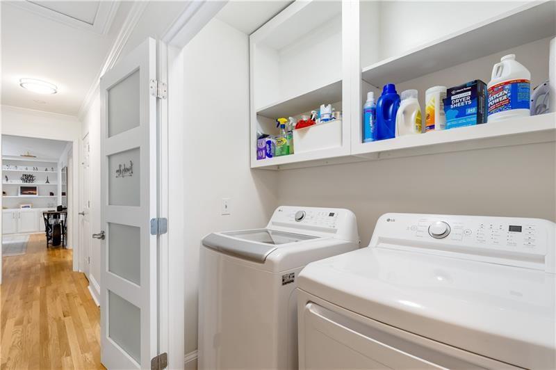 3890 Jim Owens Road Northwest Kennesaw, GA 30152 - Photo 18 of 43 a utility room with dryer washer and a view of living room