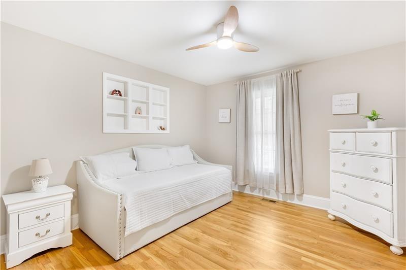 3890 Jim Owens Road Northwest Kennesaw, GA 30152 - Photo 21 of 43 a view of a bedroom with a bed and cabinet
