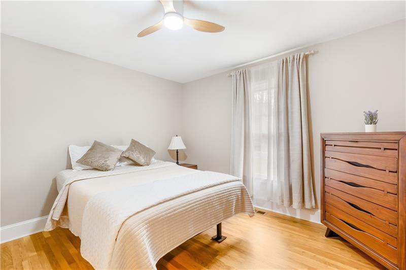 3890 Jim Owens Road Northwest Kennesaw, GA 30152 - Photo 23 of 43 a bedroom with a bed and a dresser