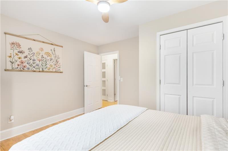 3890 Jim Owens Road Northwest Kennesaw, GA 30152 - Photo 24 of 43 a bedroom with a bed and a painting on the wall