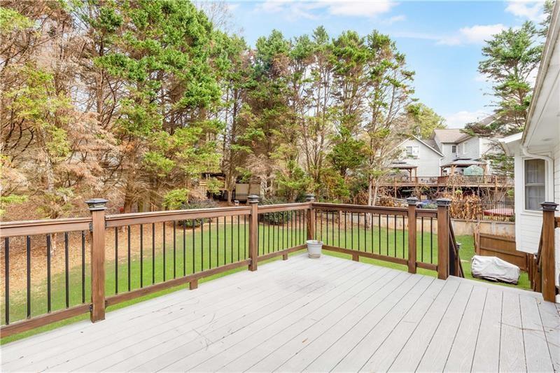 3890 Jim Owens Road Northwest Kennesaw, GA 30152 - Photo 32 of 43 a view of balcony with wooden floor and fence