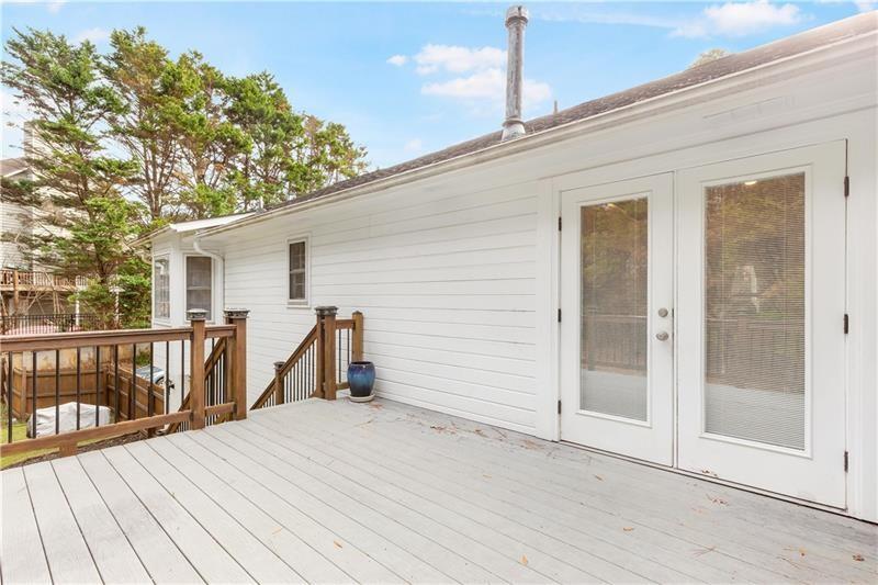 3890 Jim Owens Road Northwest Kennesaw, GA 30152 - Photo 33 of 43 a view of a house with a backyard