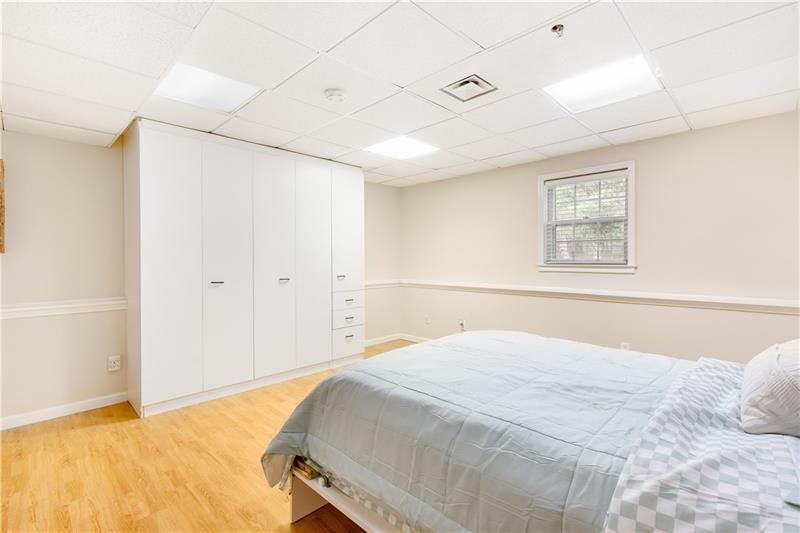 3890 Jim Owens Road Northwest Kennesaw, GA 30152 - Photo 35 of 43 a bedroom with a large bed and a window