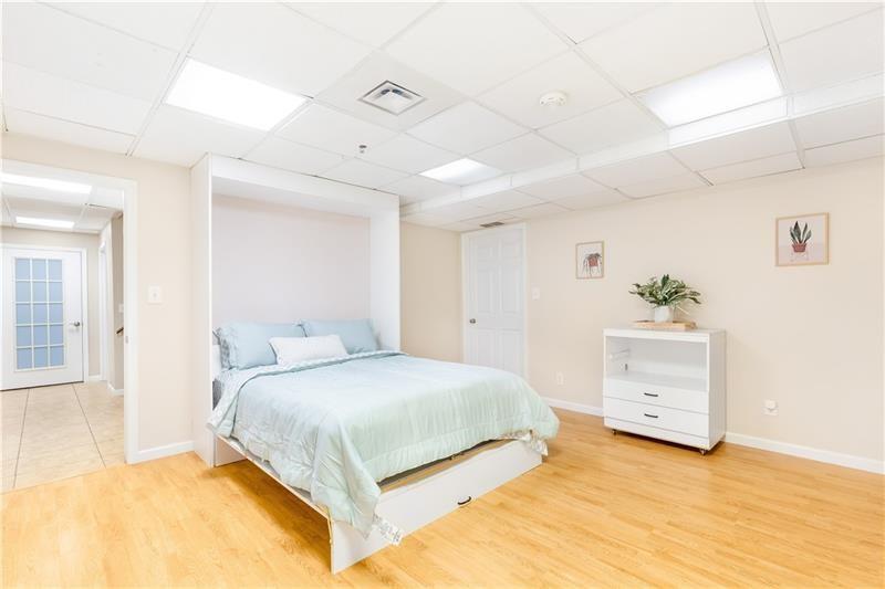 3890 Jim Owens Road Northwest Kennesaw, GA 30152 - Photo 36 of 43 a bedroom with a bed and a dresser