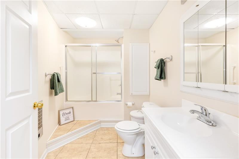 3890 Jim Owens Road Northwest Kennesaw, GA 30152 - Photo 37 of 43 a bathroom with a sink toilet and shower