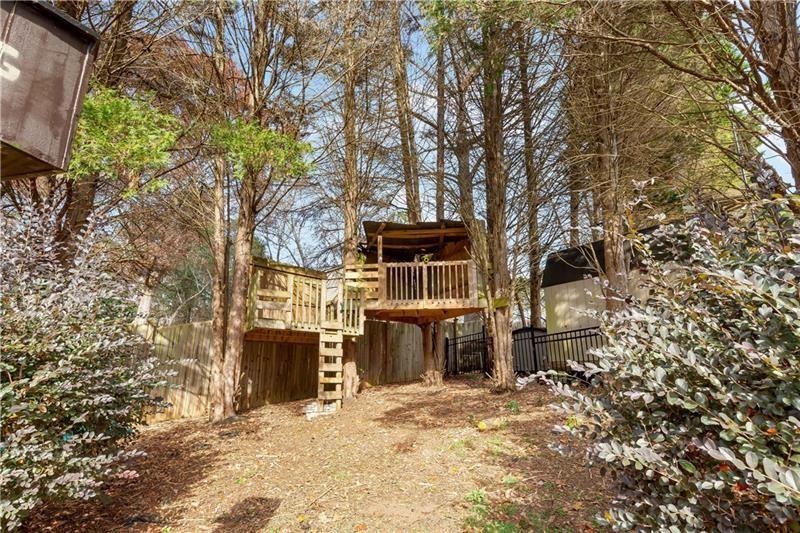 3890 Jim Owens Road Northwest Kennesaw, GA 30152 - Photo 41 of 43 a front view of a house with a yard