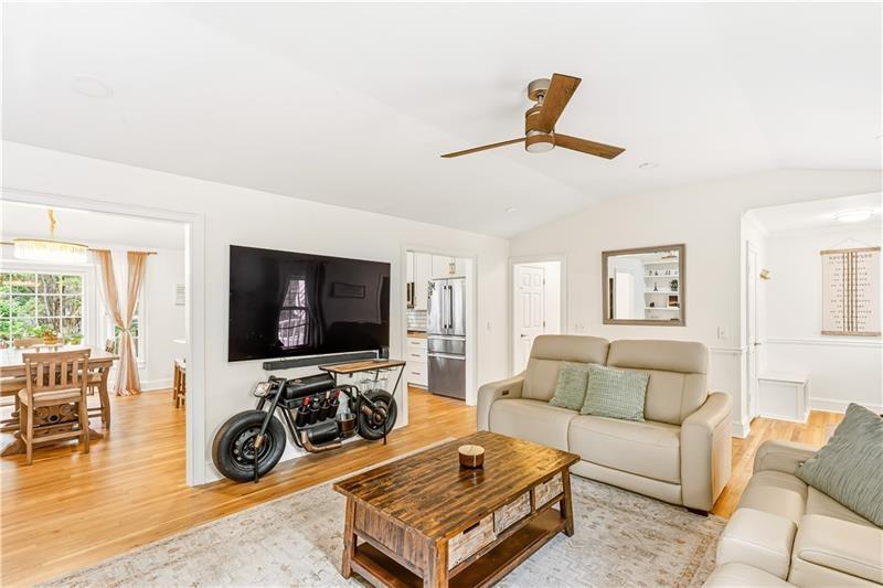 3890 Jim Owens Road Northwest Kennesaw, GA 30152 - Photo 8 of 43 a living room with furniture and a flat screen tv