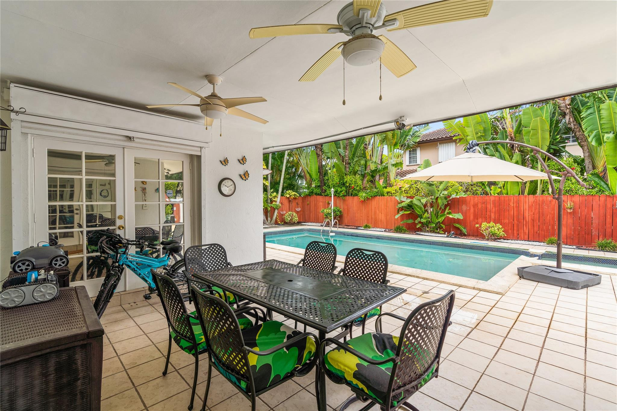 7440 Southwest 93rd Avenue Miami, FL 33173 - Photo 11 of 50 a view of an outdoor dining space with a table and chairs