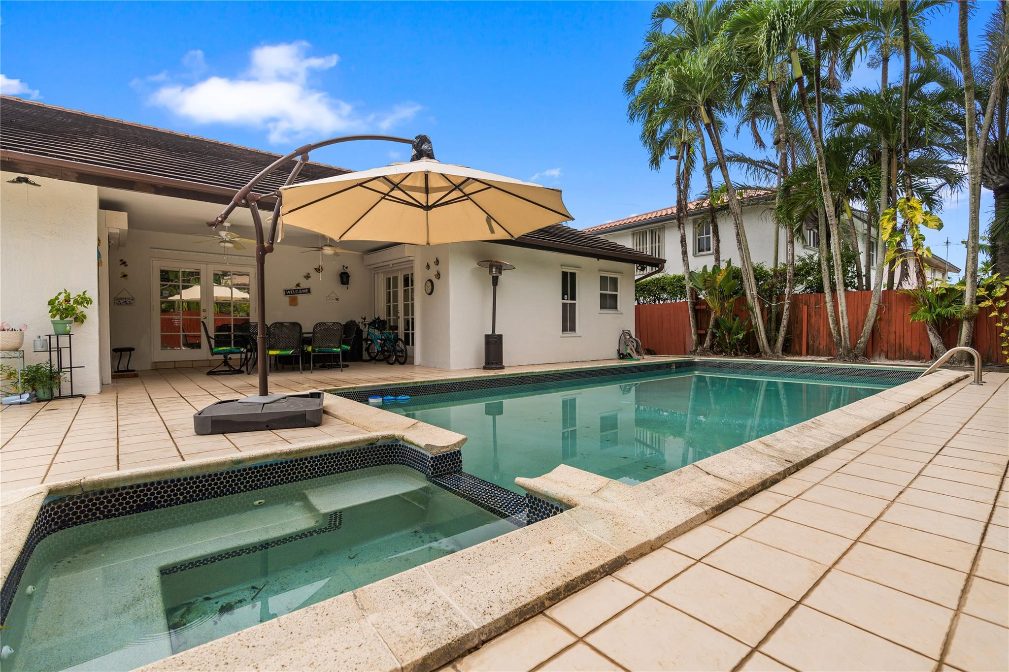 7440 Southwest 93rd Avenue Miami, FL 33173 - Photo 13 of 50 a view of a house with a swimming pool