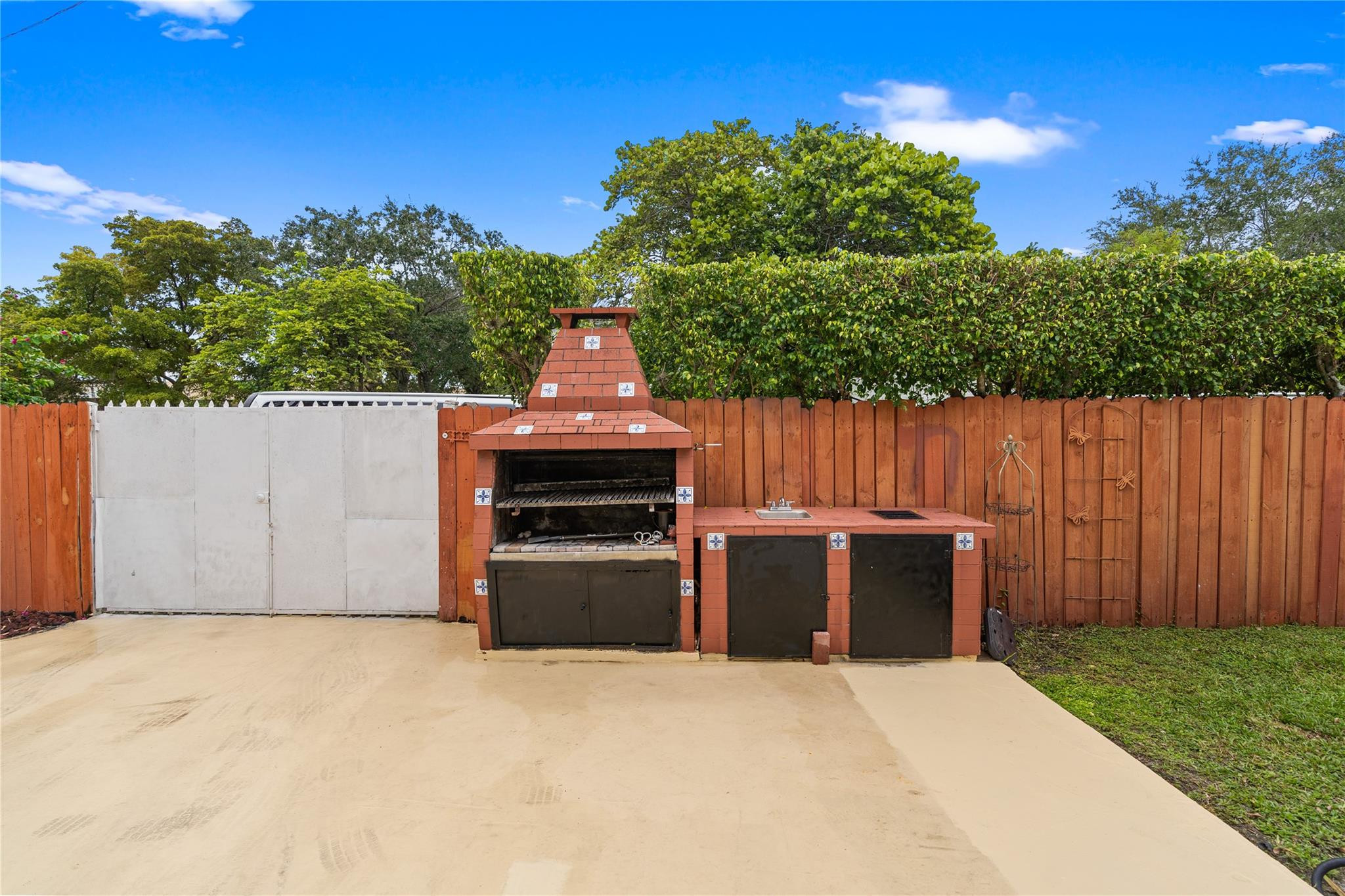 7440 Southwest 93rd Avenue Miami, FL 33173 - Photo 16 of 50 a view of backyard with outdoor seating and trees