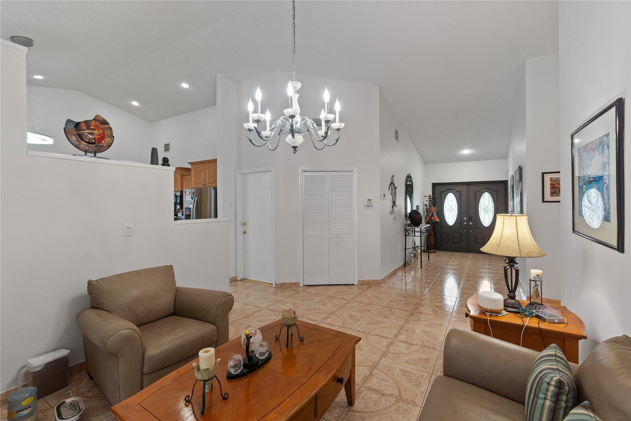 7440 Southwest 93rd Avenue Miami, FL 33173 - Photo 20 of 50 a living room with furniture and a chandelier