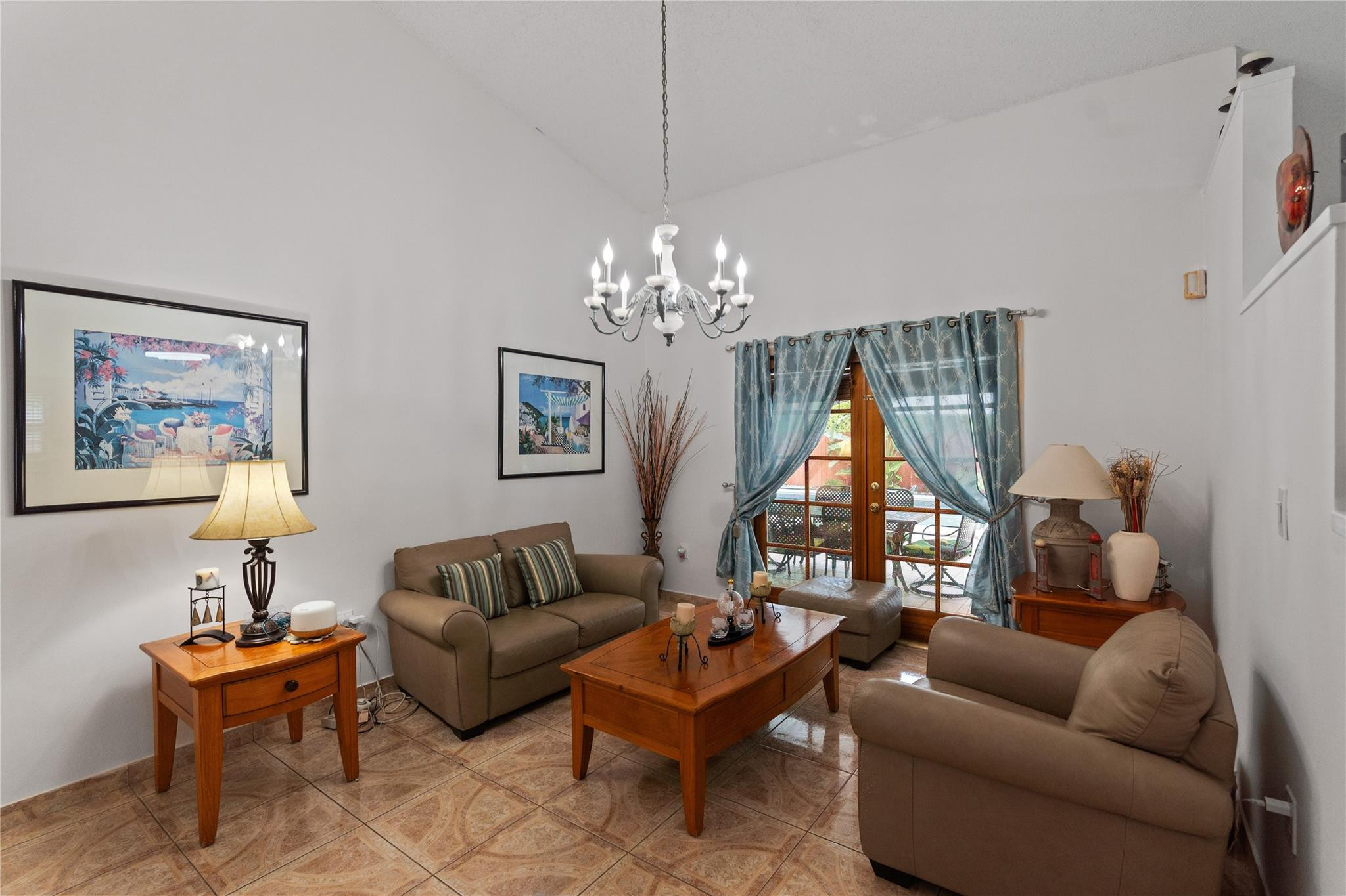 7440 Southwest 93rd Avenue Miami, FL 33173 - Photo 33 of 50 a living room with furniture and a chandelier