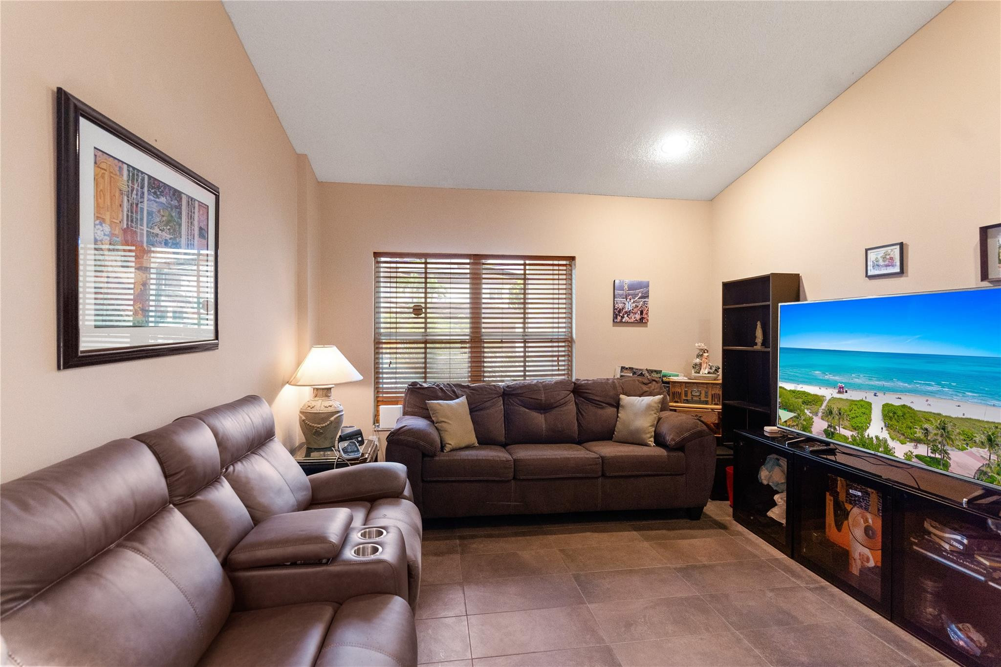 7440 Southwest 93rd Avenue Miami, FL 33173 - Photo 34 of 50 a living room with furniture and a flat screen tv