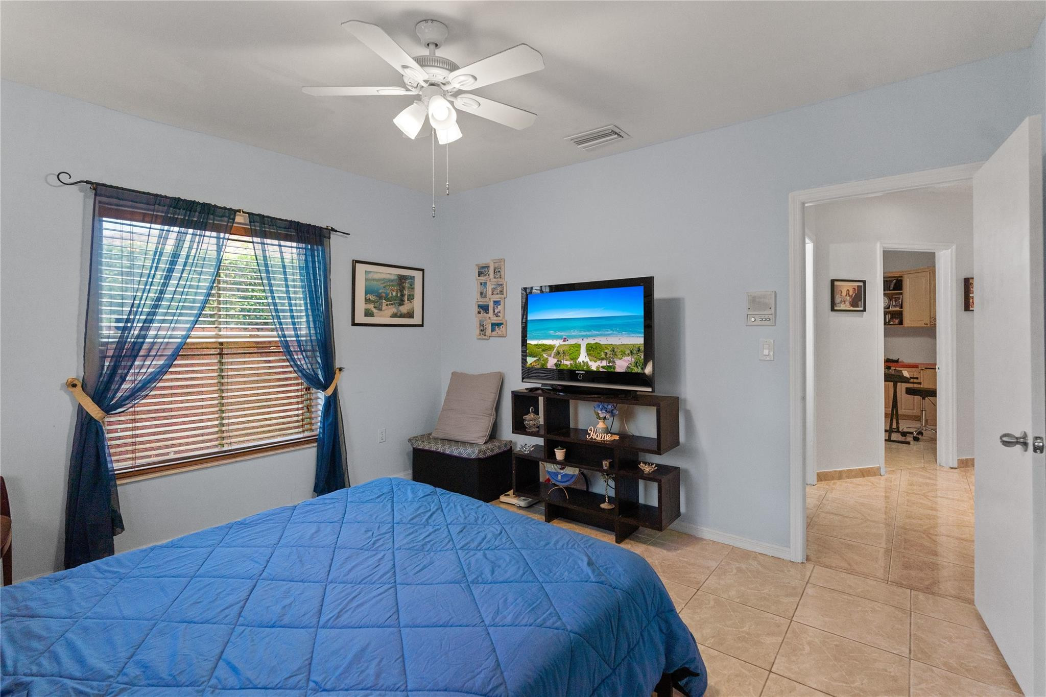 7440 Southwest 93rd Avenue Miami, FL 33173 - Photo 37 of 50 a bedroom with a bed and a chandelier