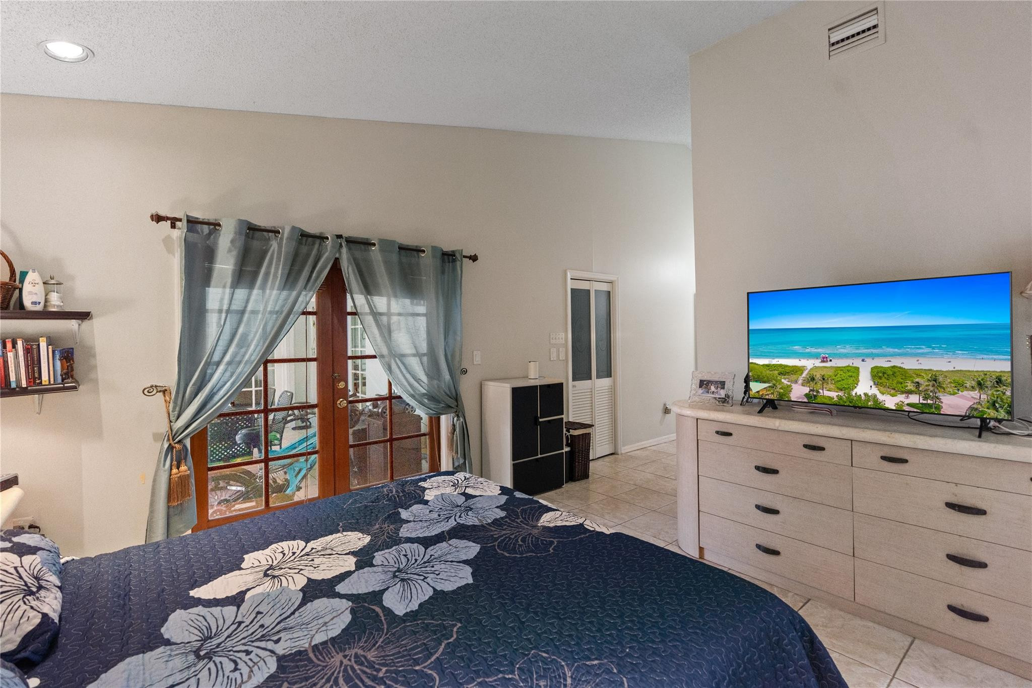 7440 Southwest 93rd Avenue Miami, FL 33173 - Photo 43 of 50 a living room with furniture and a flat screen tv
