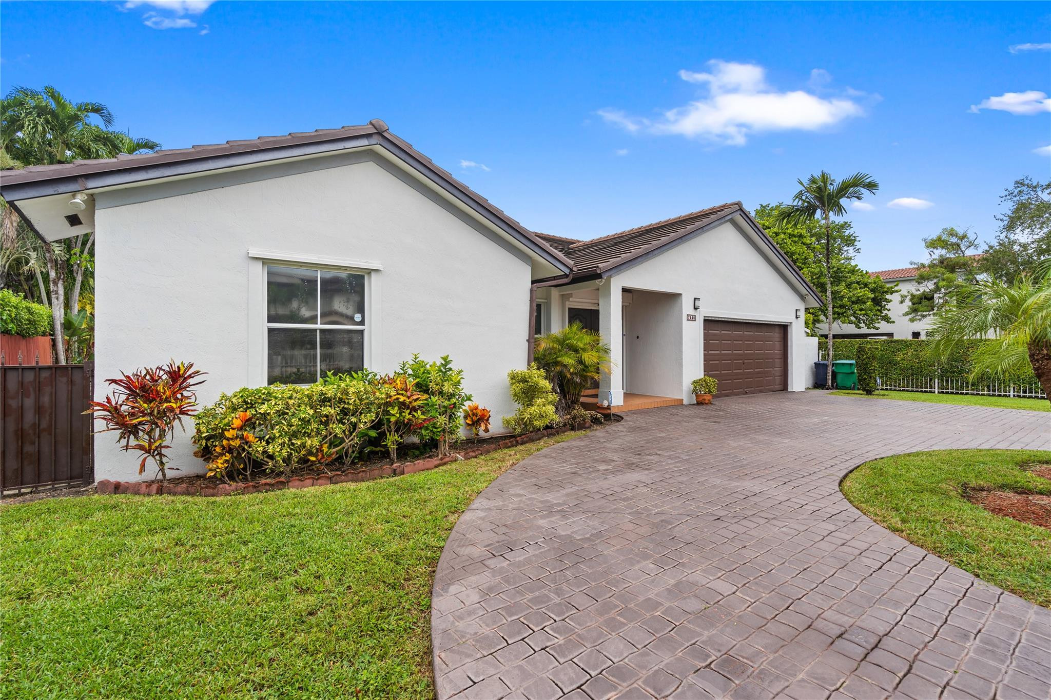 7440 Southwest 93rd Avenue Miami, FL 33173 - Photo 10 of 50 a front view of house with a garden