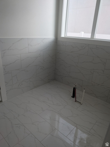 2771 West Aurora Avenue Mapleton, UT 84664 - Photo 17 of 39 White rectangular tile flooring and wainscoting with gray veining
