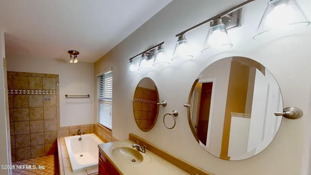 a bathroom with a sink and mirror
