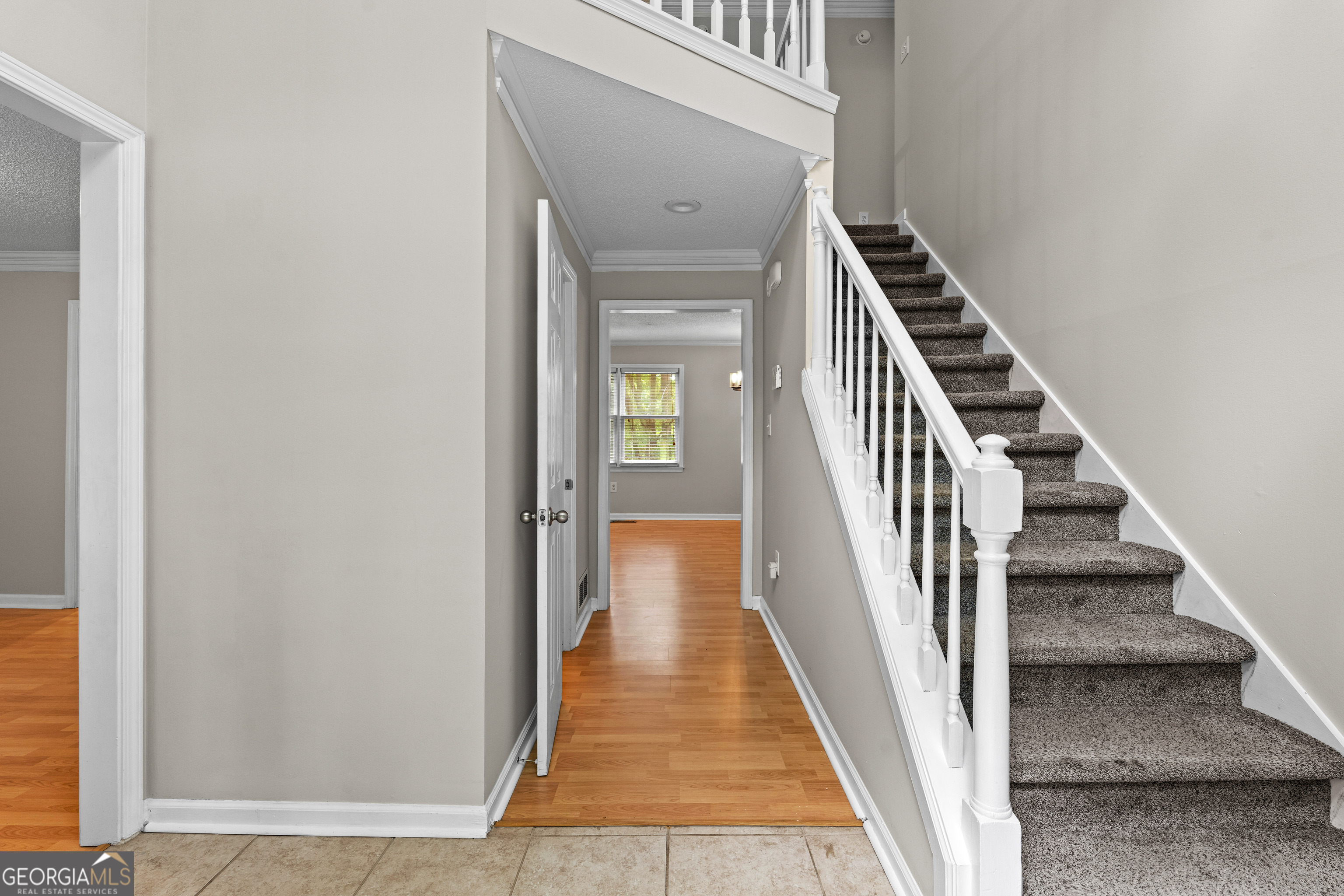 39 Springfield Court Newnan, GA 30265 - Photo 7 of 44 a view of a hallway with wooden floor and staircase
