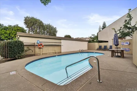 a view of a swimming pool with a patio