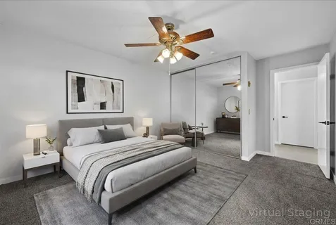 a patio with patio a couch and potted plants