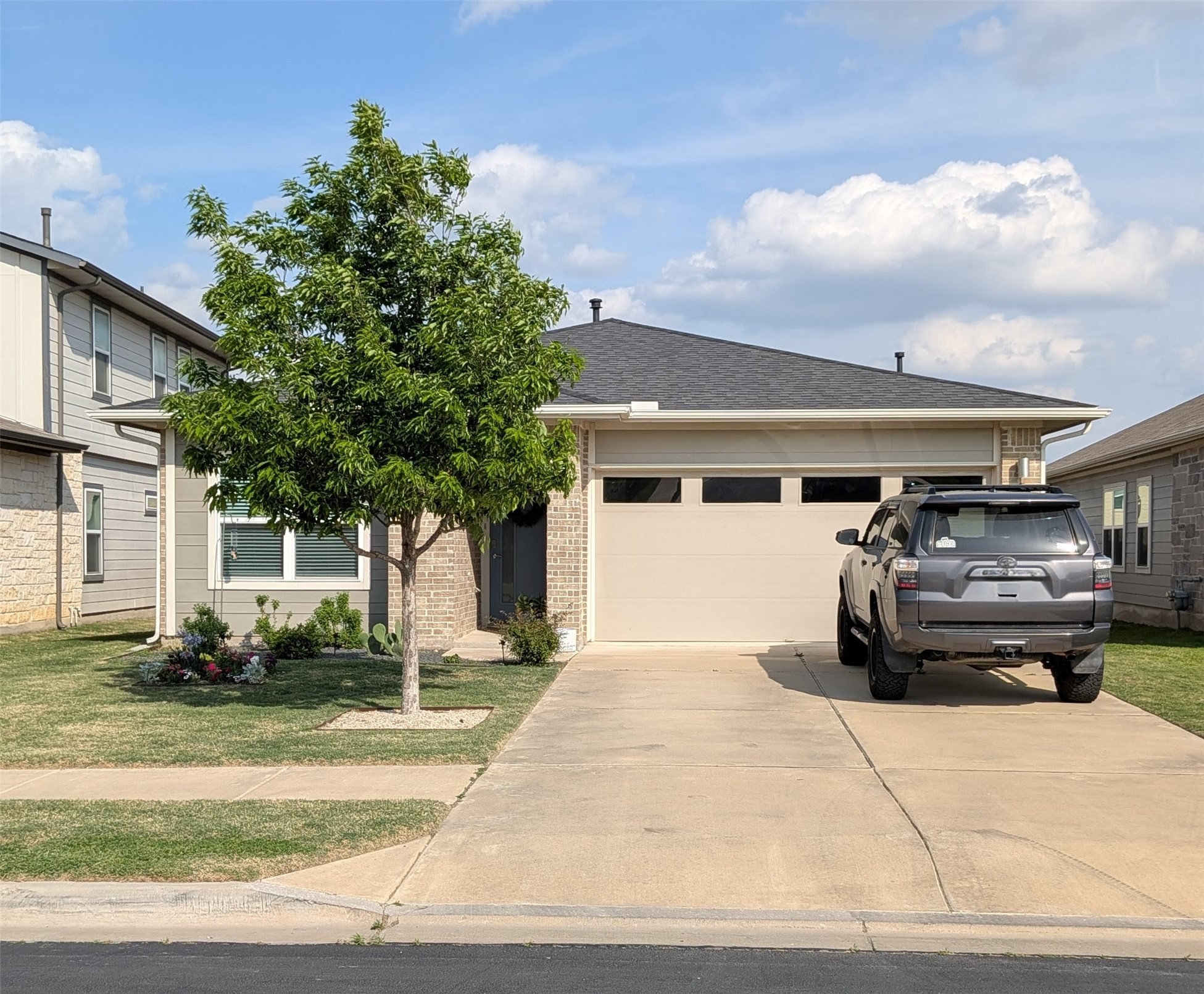 a view of a car parked front of house