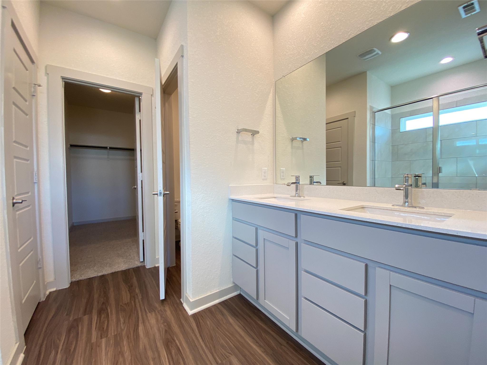 5121 Vanner Path Georgetown, TX 78626 - Photo 13 of 24 a bathroom with a double vanity sink and mirror