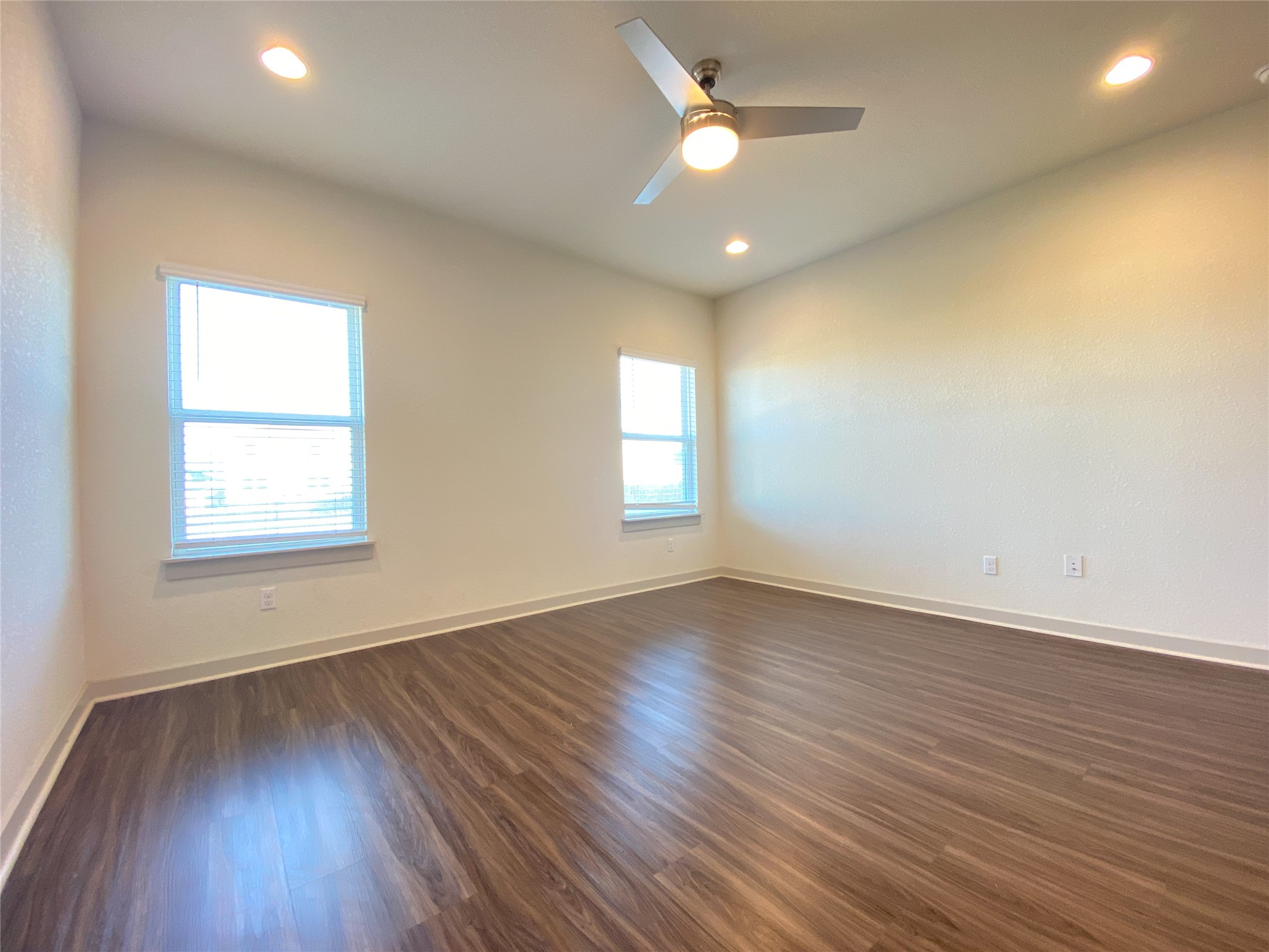 5121 Vanner Path Georgetown, TX 78626 - Photo 9 of 24 an empty room with wooden floor and windows