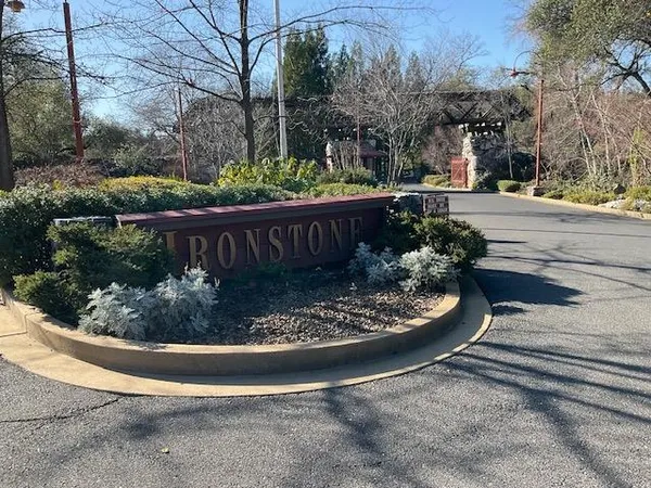 a view of a fountain in front of a house