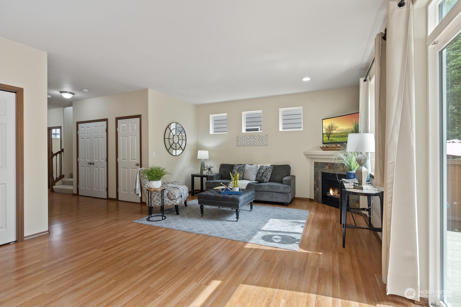 4608 146th Place Southeast Bothell, WA 98012 - Photo 13 of 39 a living room with furniture a window and wooden floor