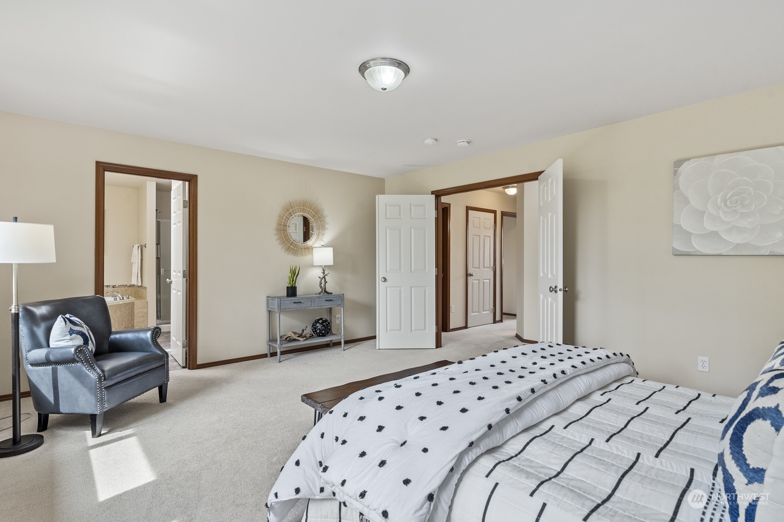 4608 146th Place Southeast Bothell, WA 98012 - Photo 18 of 39 a bedroom with a bed couch and a large mirror