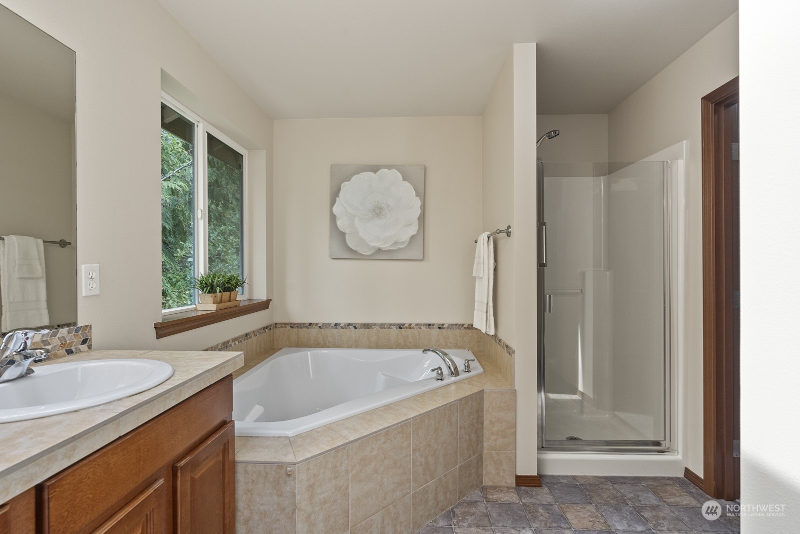 4608 146th Place Southeast Bothell, WA 98012 - Photo 22 of 39 a bathroom with a bathtub and a sink