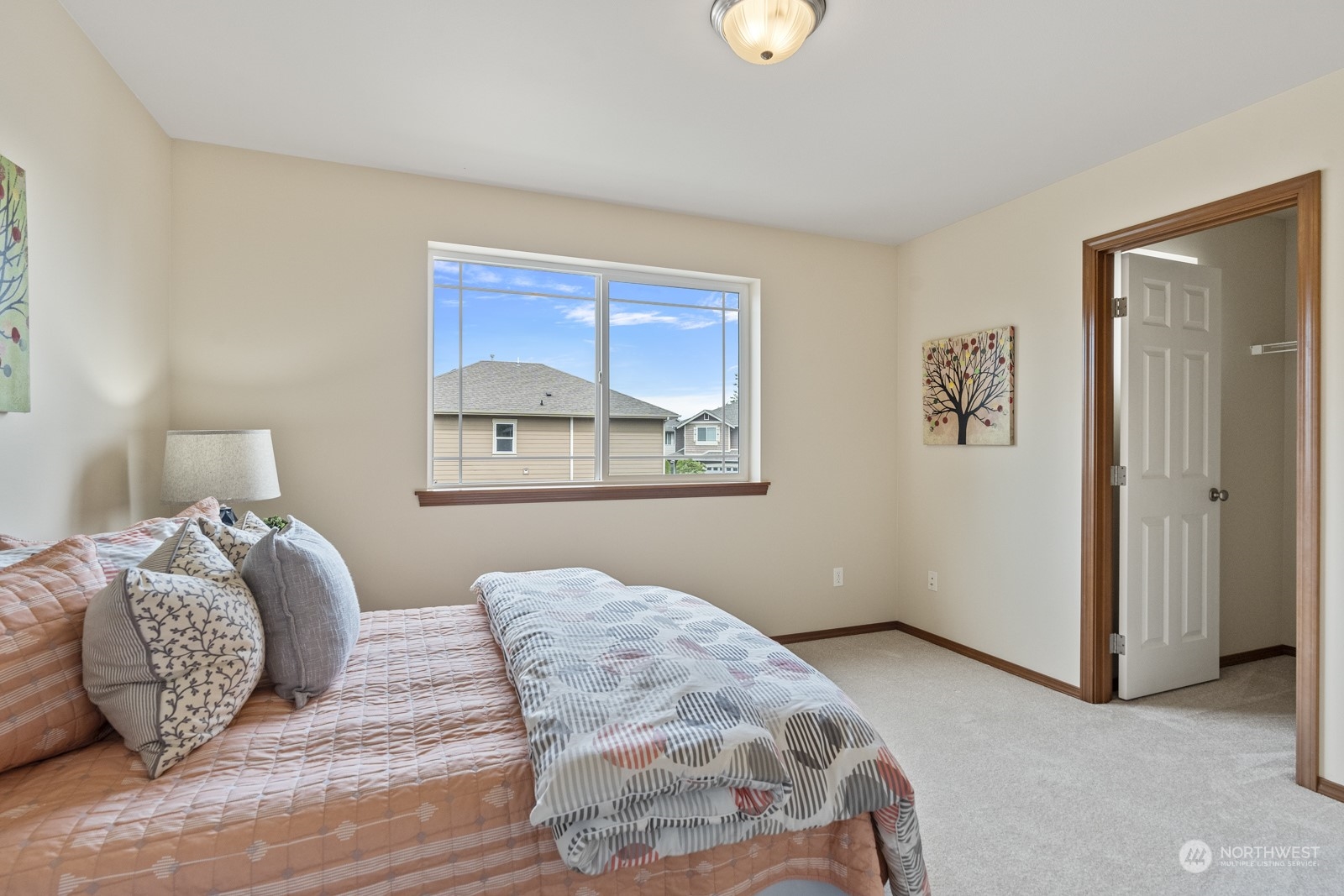 4608 146th Place Southeast Bothell, WA 98012 - Photo 26 of 39 a bedroom with a bed and painting on the wall
