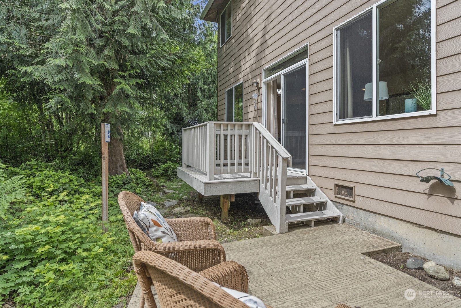 4608 146th Place Southeast Bothell, WA 98012 - Photo 34 of 39 a view of backyard with deck and outdoor seating