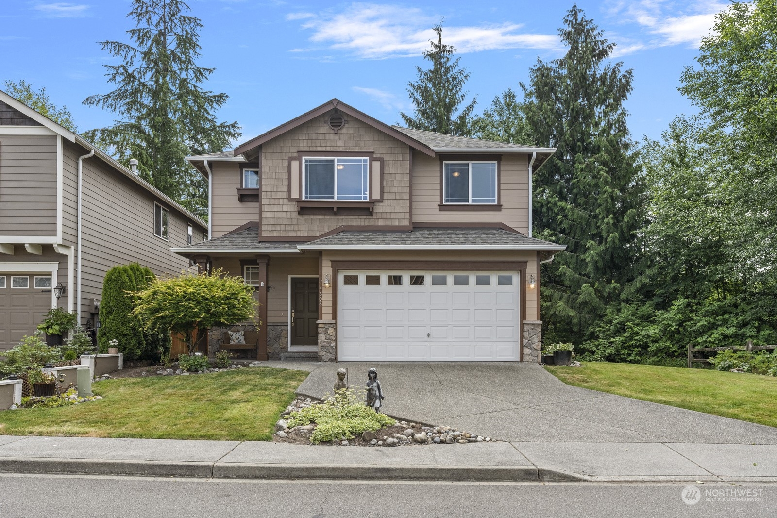4608 146th Place Southeast Bothell, WA 98012 - Photo 36 of 39 a front view of house with garage and yard