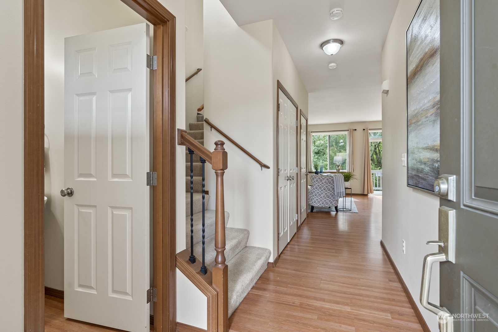 4608 146th Place Southeast Bothell, WA 98012 - Photo 4 of 39 a view of a hallway with wooden floor and staircase