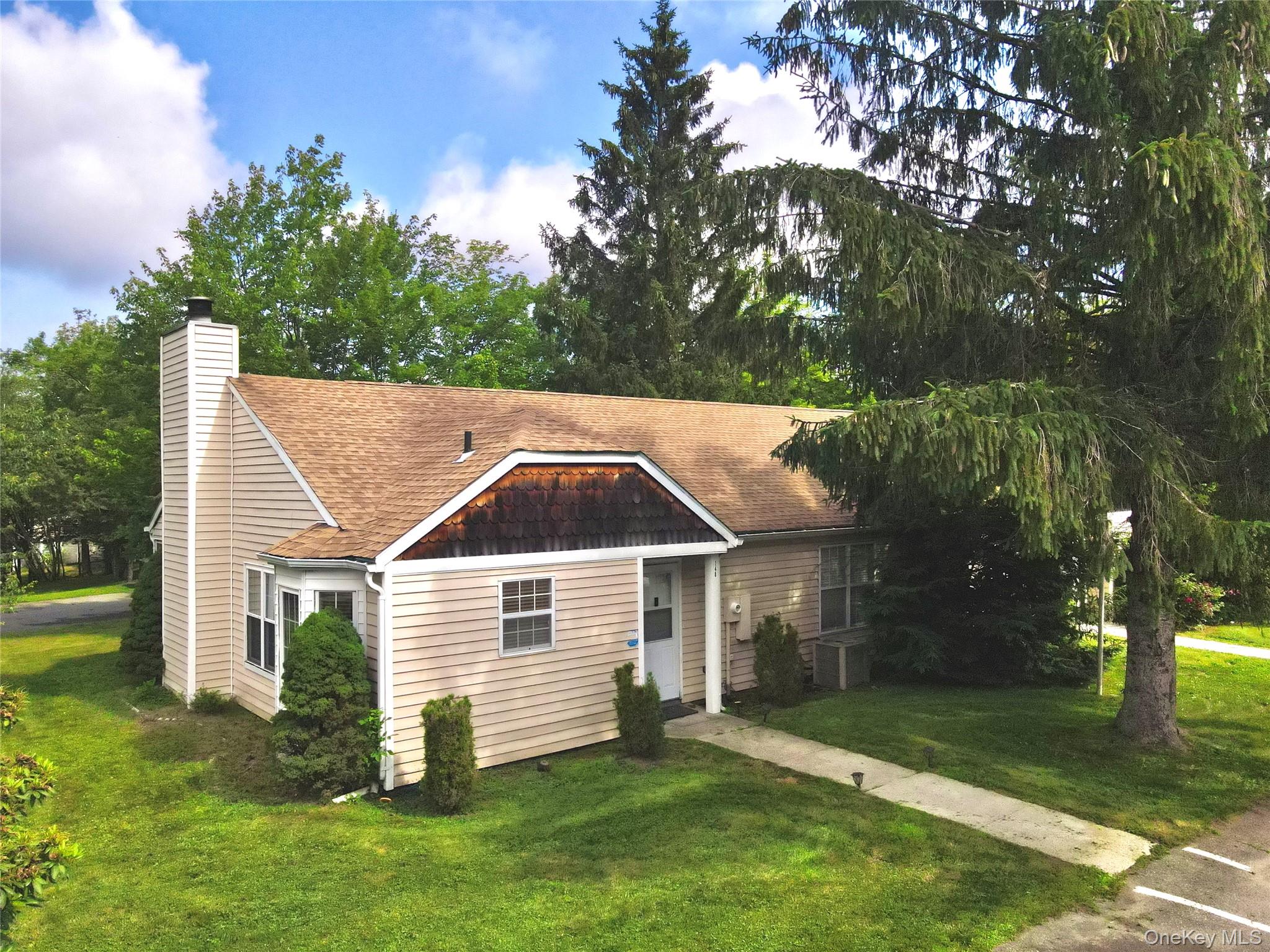 148 Hidden Ridge Drive Monticello, NY 12701 - Photo 1 of 1 a view of a backyard with a garden