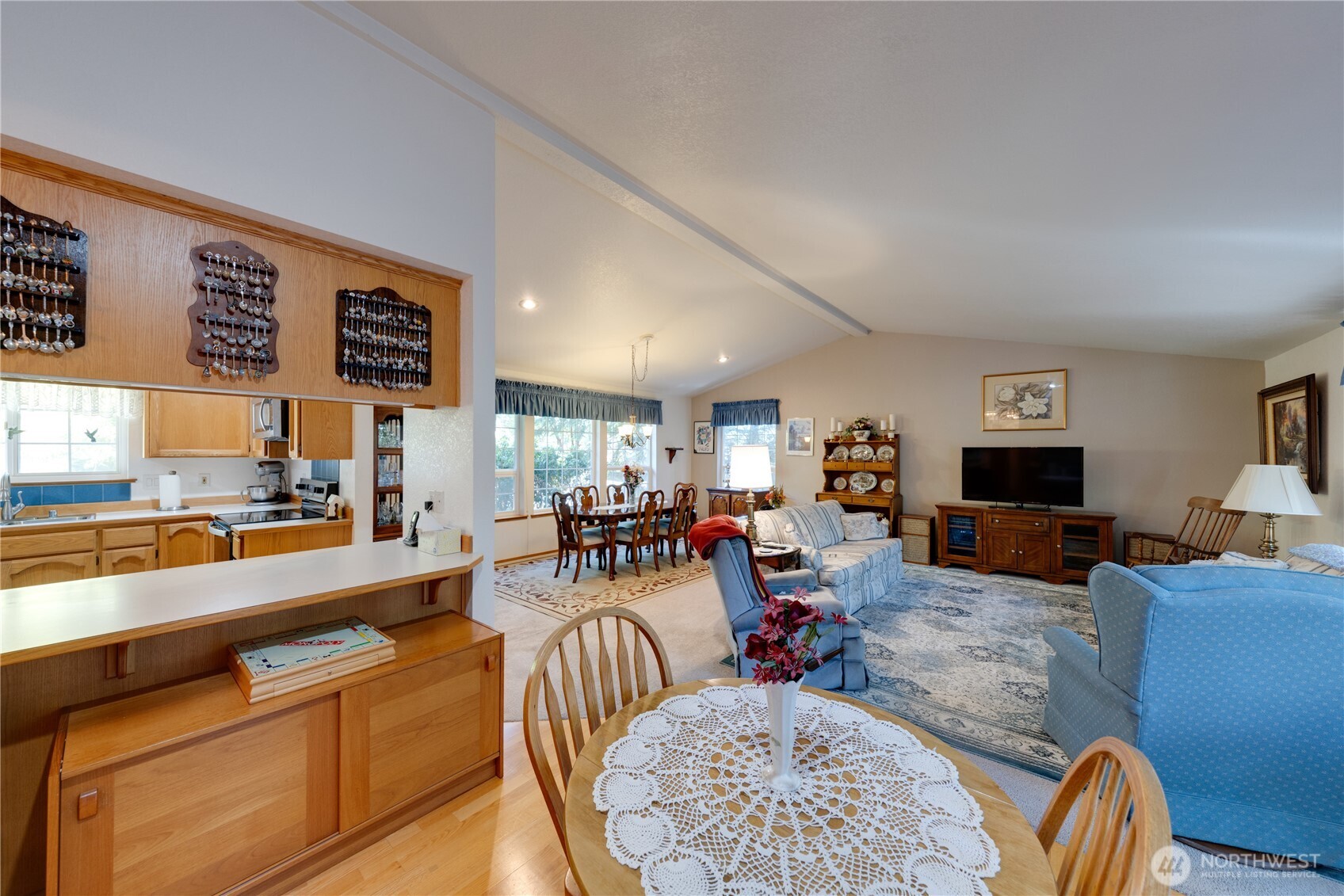 399 Tilingit Place La Conner, WA 98257 - Photo 11 of 39 a living room with furniture kitchen view and a large window