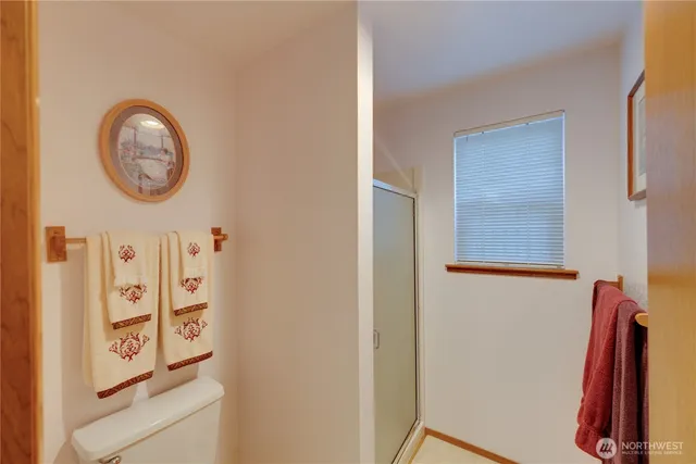 a bedroom with a bed and a lamp