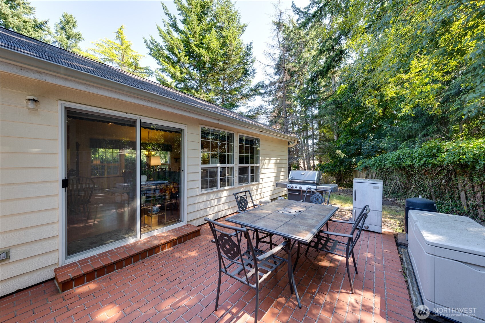 399 Tilingit Place La Conner, WA 98257 - Photo 28 of 39 a view of a backyard with a dining space and a patio